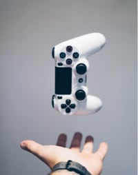 a hand with a game controller