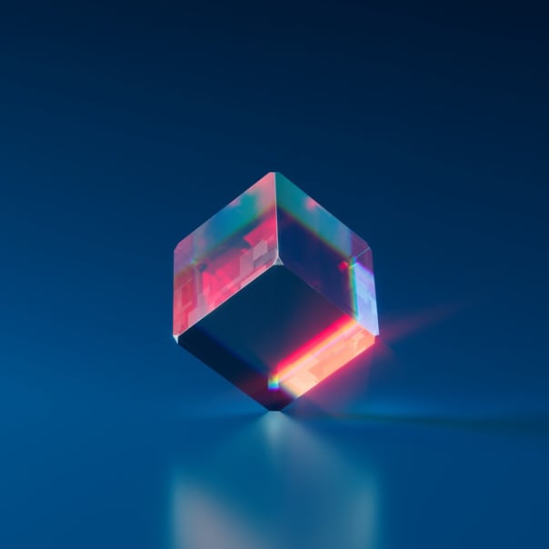 Holographic cube with vibrant colors against a dark blue background